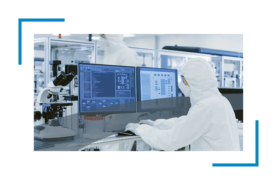 Someone in hazmat suit working at computer