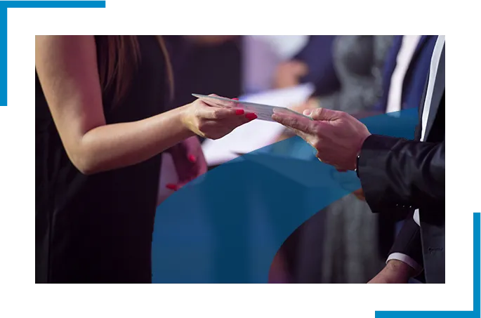 A man and a women holding apaper