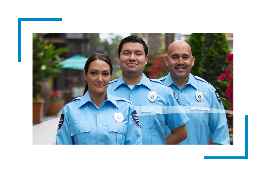 Three security professionals with badges